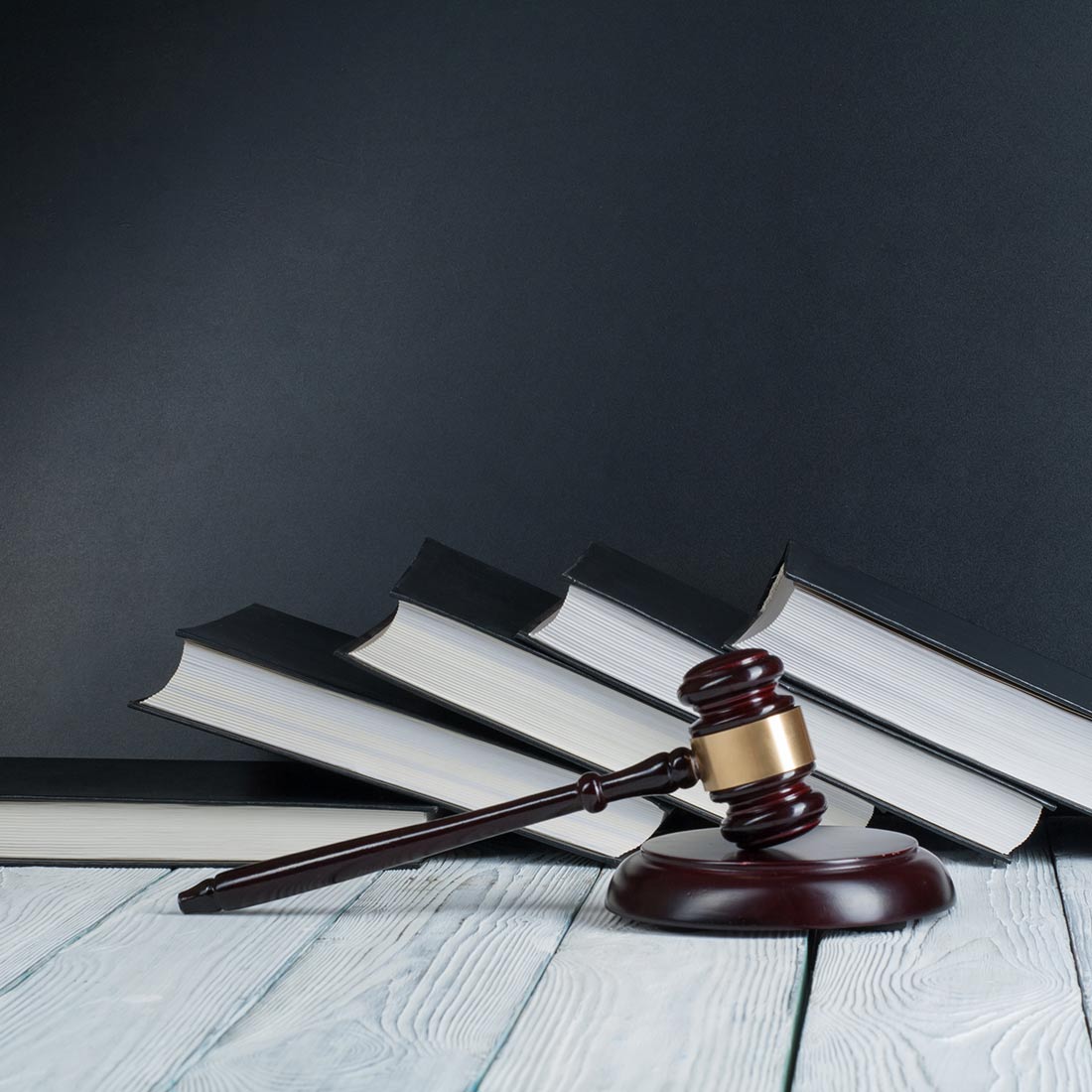 gavel with books old wooden desk