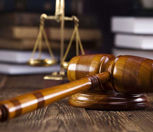portfolio6-518x450 gavel with books old wooden desk